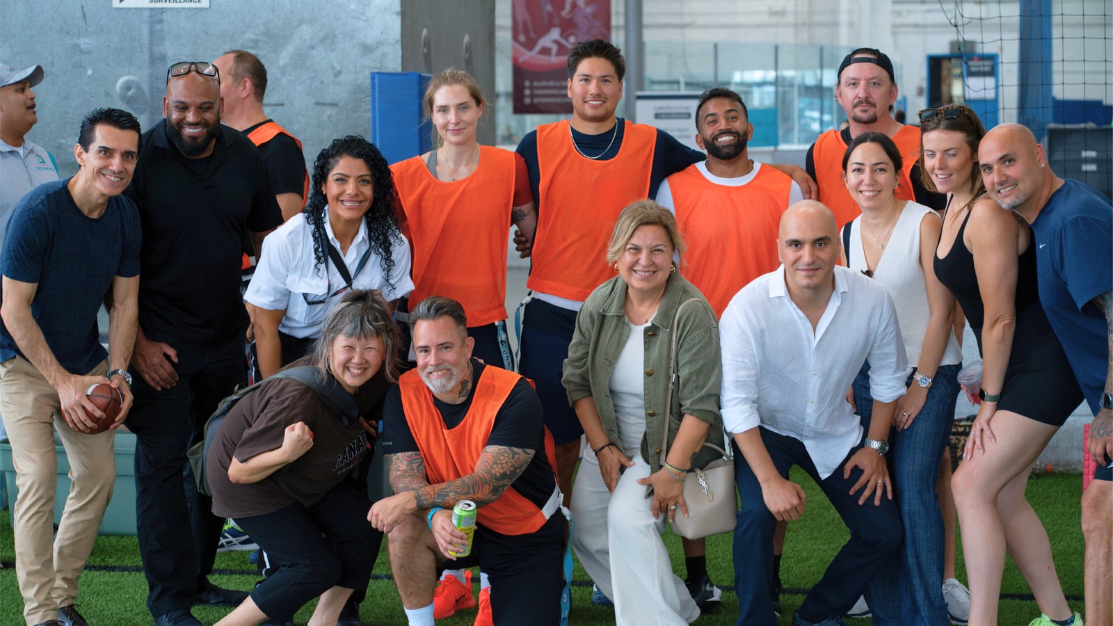 Sinan Erdemir with players and volunteers at a community flag football event