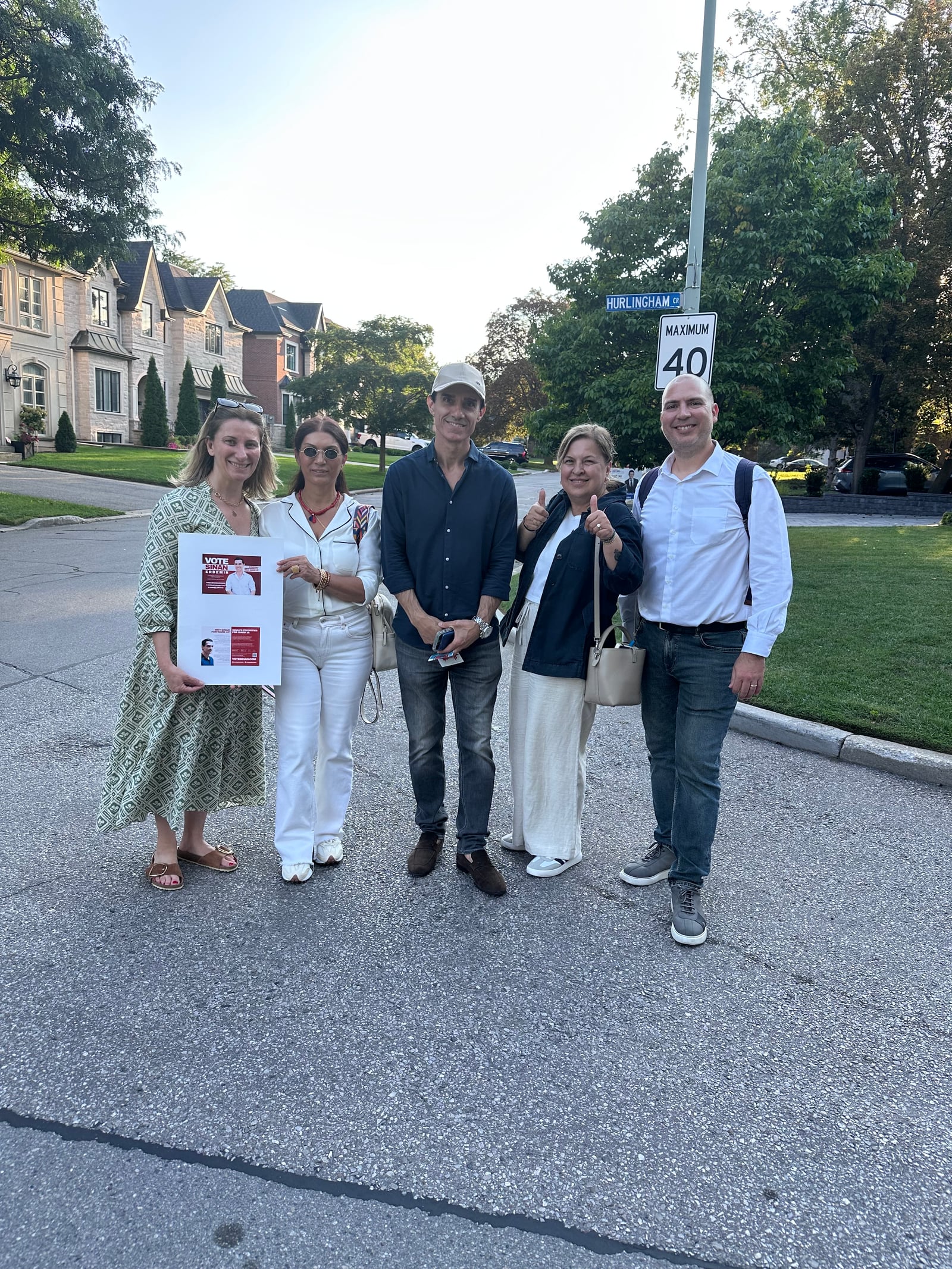 Sinan Erdemir with campaign volunteers on a Don Valley East street